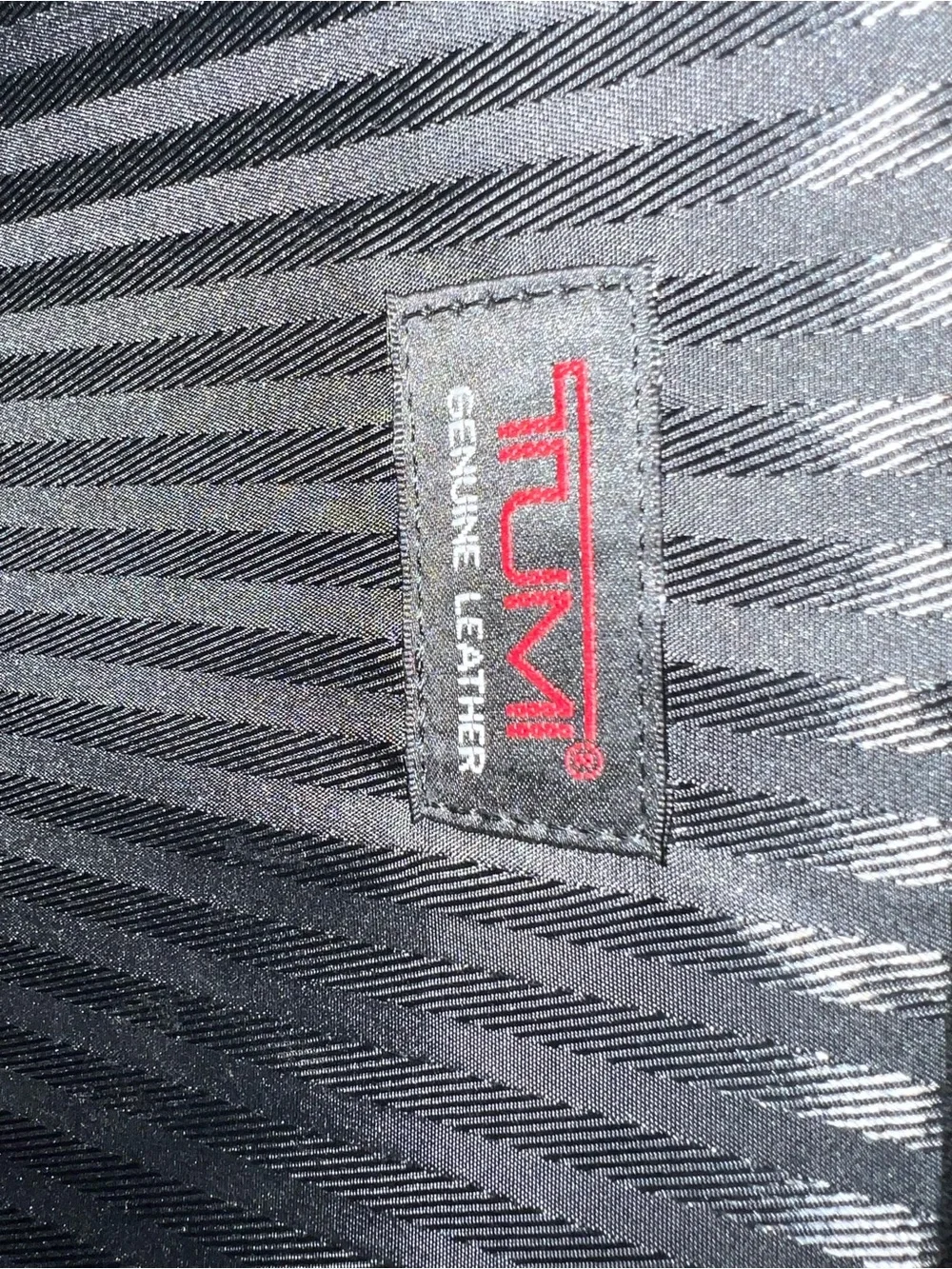 Tumi sleek leather